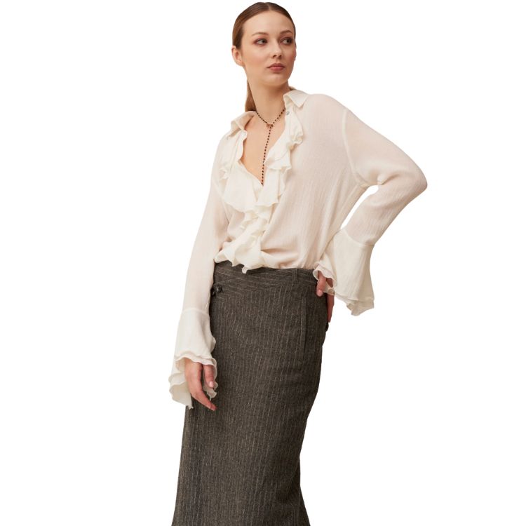 Wool muslin shirt with ruffles and calla cuffs.