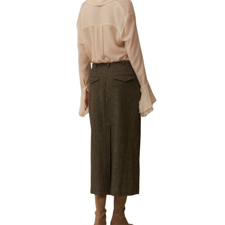 Wool muslin shirt with ruffles and calla cuffs.
